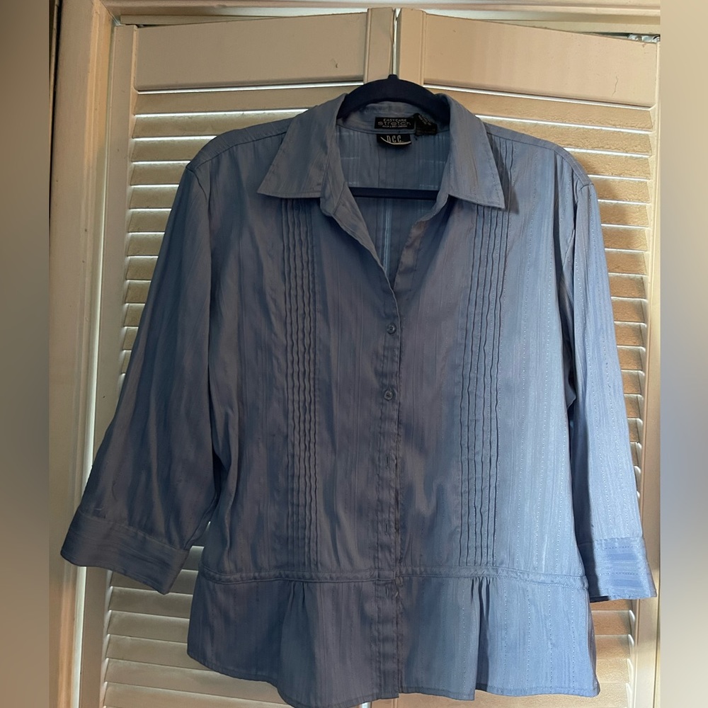 Blue button down stretch shirt with long sleeves